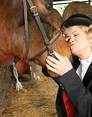 Mature slut playing with herself in a barn