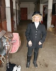 Mature slut playing with herself in a barn